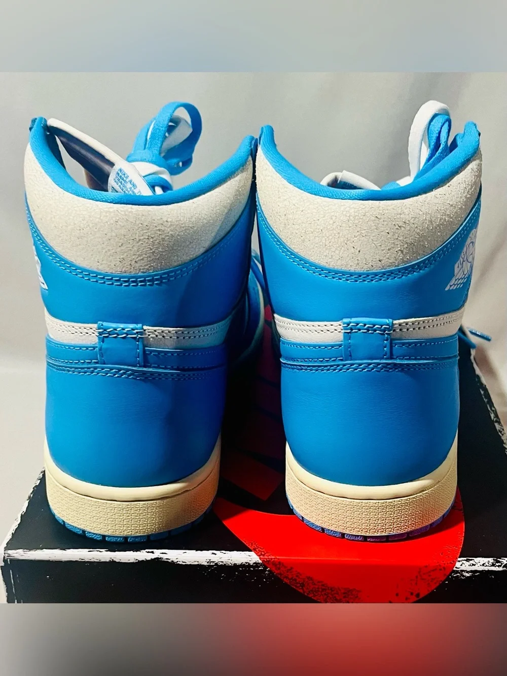 Nike Jordan Retro High-Top Sneakers in Baby Blue and White with Cream Midsole